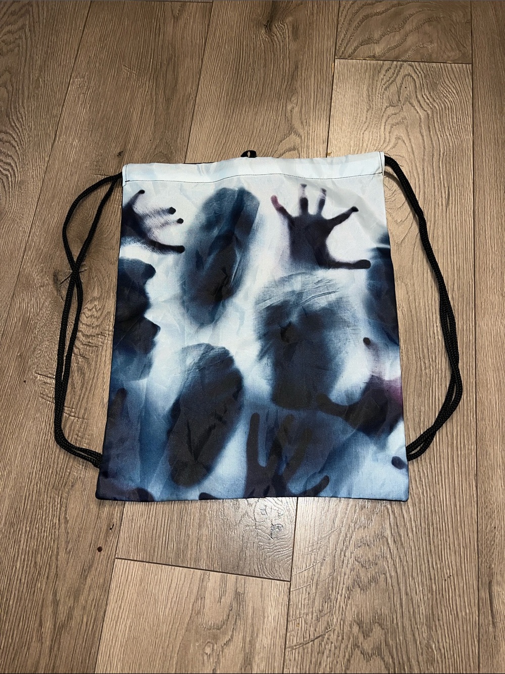 Men's Drawstring Halloween Spooky Backpack with Blue and Black Handprint Design